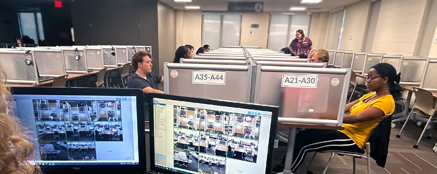 Photo of students being monitored while taking exams in the Testing Center