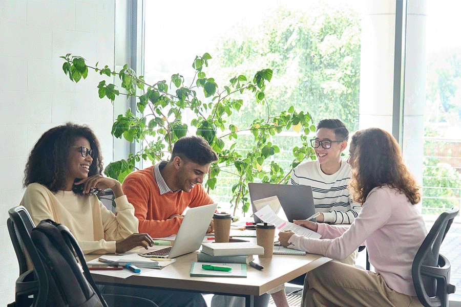 Group of professionals working together sitting at a table