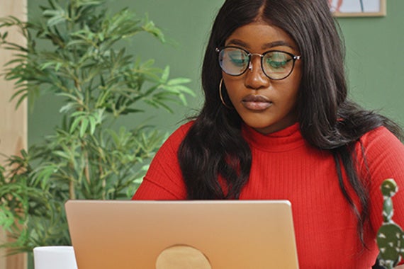 Image of a person working at a computer
