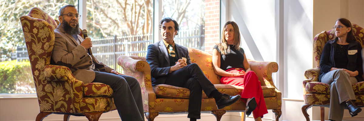 FSU QM certified instructors seated on sofa chairs during a panel disscusion