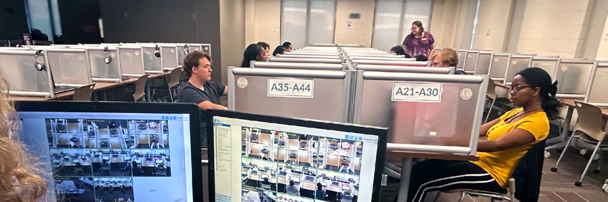 Photo of students being monitored while taking exams in the Testing Center