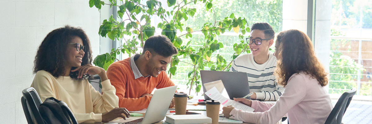 Group of professionals working together sitting at a table