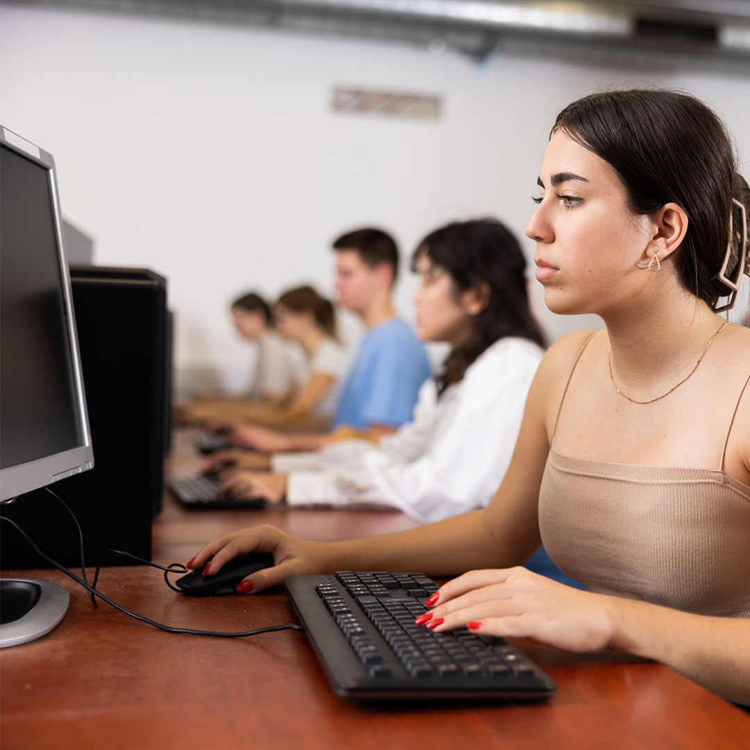 Image of a student taking an online exam at a testing center